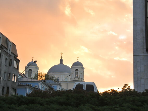 view of a domed house of worship at sunrise or sunset